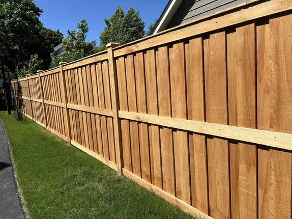Close-up view of high-quality wood privacy fence showcasing smooth finish, consistent grain, and sturdy construction